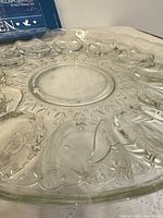 Top view of clear glass egg platter showing recesses and central well