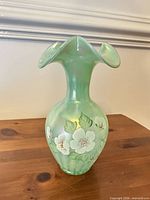 Full view of vase showing shape, floral painting, color