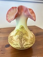 Full view of yellow to pink hand-painted glass vase with ruffled rim