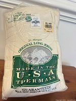 Front of packaged J.E. Morgan thermal shirt showing branding and Made in USA text