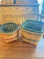 Both Longaberger baskets side by side showing shapes, liners, handles