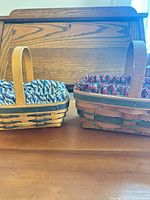 Both Longaberger baskets side by side showing size and liners