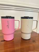 Front view of both tumblers showing colours and Reduce logos