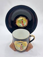 Cup and saucer front showing design and gold trim