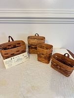 Group shot of all four wooden baskets showing sizes and shapes