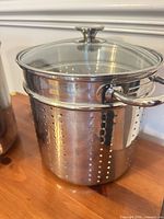 Stock pot assembled with strainer insert and glass lid