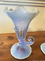 Single vase front view showing opalescent color and rim