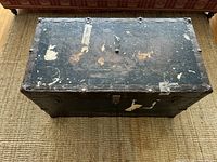 Top view of closed trunk showing worn paint and label residue