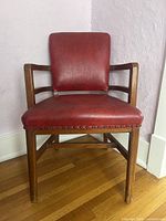 Front view showing red leather seat/back and wood frame