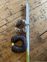 Both neck pillows and sealed world map roll displayed on floor