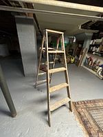 Full view of the wooden step ladder front side showing height and number of steps