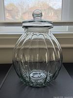 Full view of jar with lid showing ribbed design