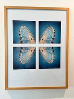Framed four-panel Ferris wheel photo collage artwork in wood frame