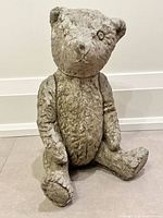 Front view of concrete teddy bear statue