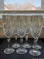 Front view of all six crystal champagne flutes