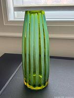 Full height view of vase showing color and vertical panel cuts