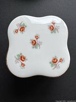 top view showing rose pattern and scalloped square shape