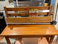 Full view of wooden wine rack on table, tape measure indicating 34 in length