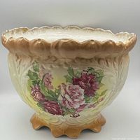 Front view showing floral transfer, scrollwork, ruffled rim