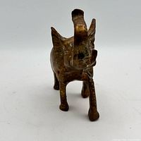 Front view of brass elephant with raised trunk