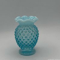 Front view of vase showing hobnail body and ruffled rim