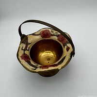 Top view showing scalloped hand-painted rim and interior brass bowl