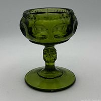 Side view of green King’s Crown goblet showing pattern and pedestal
