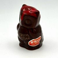 Front view of brown ceramic owl with red glaze, Algonquin Park inscription and McMaster sticker visible