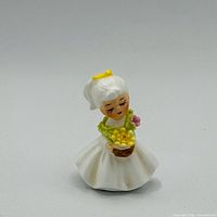 Front view of Napco November flower girl figurine