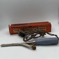 Curling iron, cord and box full view