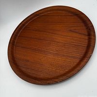 Top view of round teak serving tray