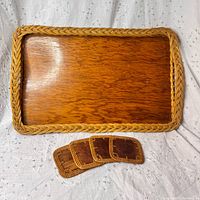 wooden tray with wicker edge and two coasters