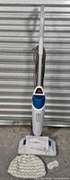 Full view of Bissell PowerFresh steam mop with cord, base pad, extra pad, fragrance discs and manual
