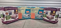 Four boxed Cropper Hopper Photo Organization Systems