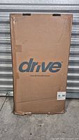 Front of sealed Drive box containing overbed table