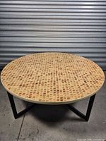 Top view of the round table showing full mother of pearl inlay surface