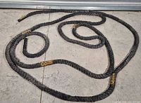 Coiled battle rope on floor