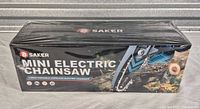 Front of sealed Saker mini electric chainsaw box