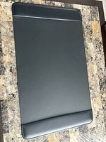 Full view of black desk pad on table