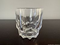 Single faceted clear glass tumbler showing shape and clarity