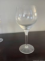 Front view of a clear stemmed red wine glass