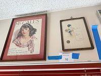 Overall view of both framed prints mounted on wall