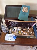 Overall view of display box, presentation case, thimbles and oversized thimble