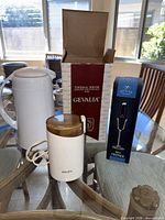 Entire lot showing grinder, carafe, and boxed frother