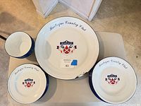 Top view showing platter and two plates with crest and text