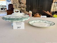 Covered tureen and matching platter displayed together