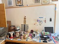 Front view of entire tack board mounted above desk