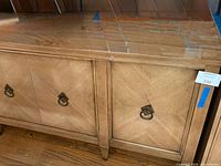 Front view of buffet showing doors, hardware, finish wear