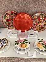 Group shot showing all trays, trivets and basket
