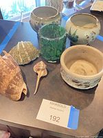 Group shot showing all planters, votive holder and shells